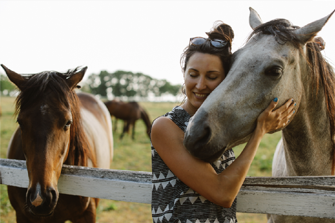 A woman with two horses